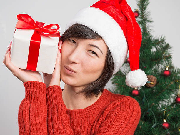 istock Woman holding a gift box 452126779
