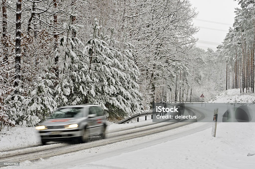 Traffic on a wintry road Car on a wintry road. Germany, Brandenburg Brandenburg State Stock Photo