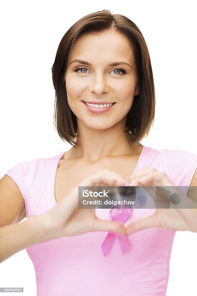 woman with pink cancer ribbon healthcare, medicine and breast cancer concept - woman with pink cancer ribbon Breast Stock Photo