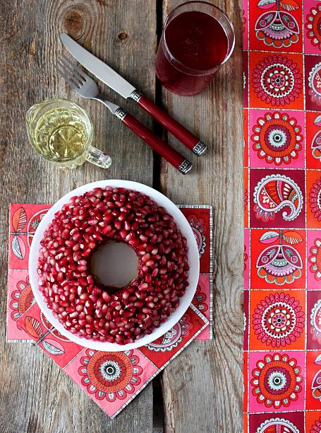 istock Bracelet shaped pomegranate salad on wooden background 452150983