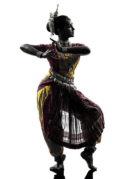Woman Performing Bharatnatyam Against White Background
