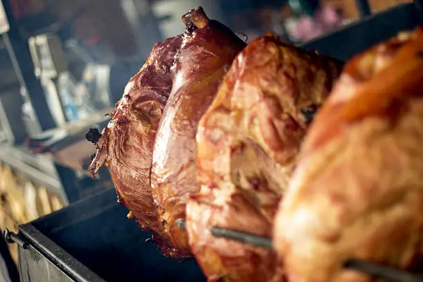 Roasted pork knuckles  on a grill