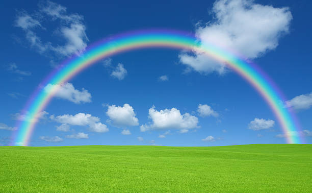 istock Green field and rainbow 452162759