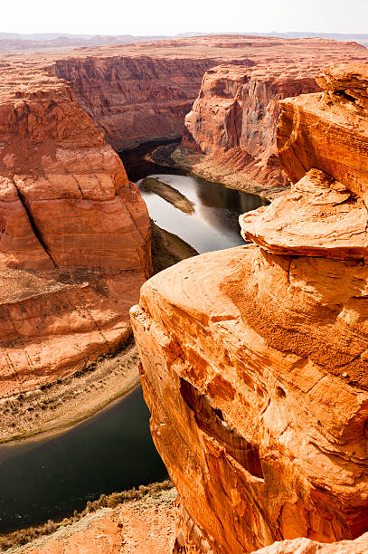 Deep Canyon Colorado River Desert Southwest Natural Scenic Lands Vertical The Colorado River Meanders Cutting into What Becomes the Grand Canyon horseshoe bend river stock pictures, royalty-free photos & images