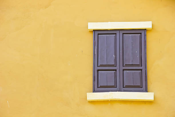istock Close the window background color to a yellow wall 452171697