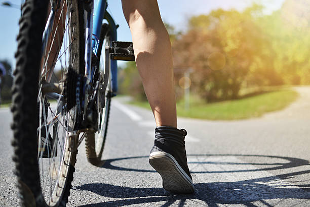 istock young woman with bicycle 452176563