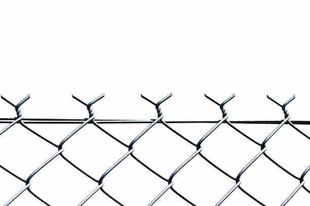 istock Closeup  chain link fence against white background, copy space 452178859