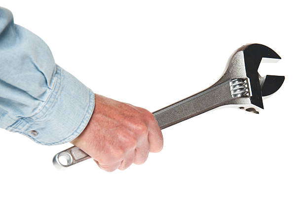 istock Workman / Mechanic Holding Large Crescent Wrench, Isolated on White 452179181