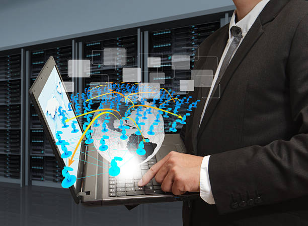 istock business man holds laptop computer and social network in server 452190529