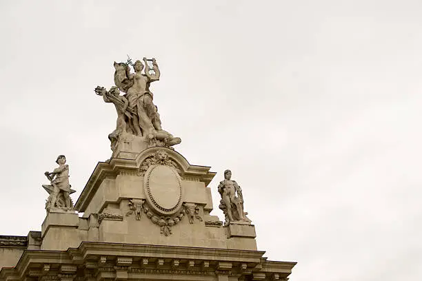 Decorative statues of Alexander III bridge in Paris