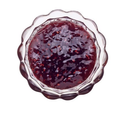 A top down view of a bowl of boysenberry jam. Clippin path included.