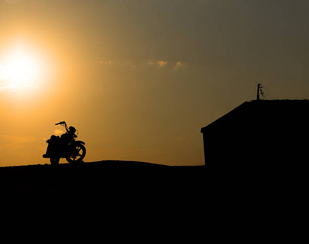 istock Motorcycle silhouette against the sunset 452217913