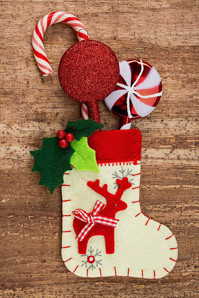 istock Christmas decorations and sock on wood background. 452222251