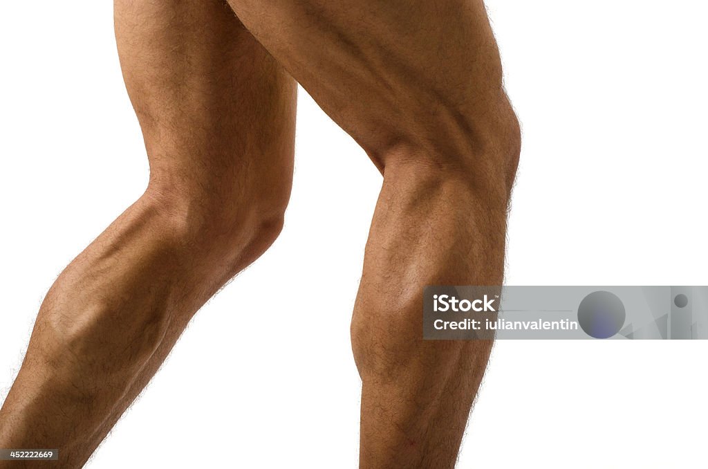 Primer plano de bodybuilder muscular en las piernas - Foto de stock de Hombres libre de derechos