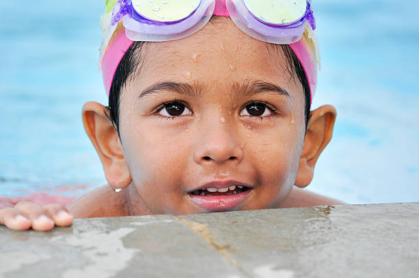 istock Asian india kid in the swimming pool 452227363