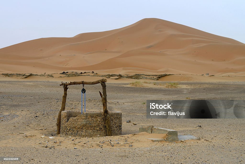 Water well in desert Water well in Sahara Desert, Morocco Well - Structure Stock Photo
