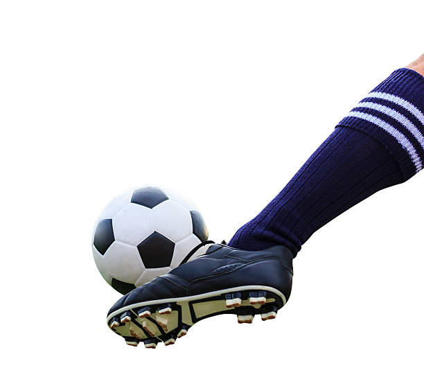 istock foot kicking soccer ball isolated with clipping path 452239259