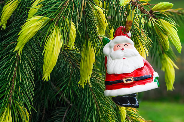 istock Santa Claus hanging on Christmas Tree 452243921
