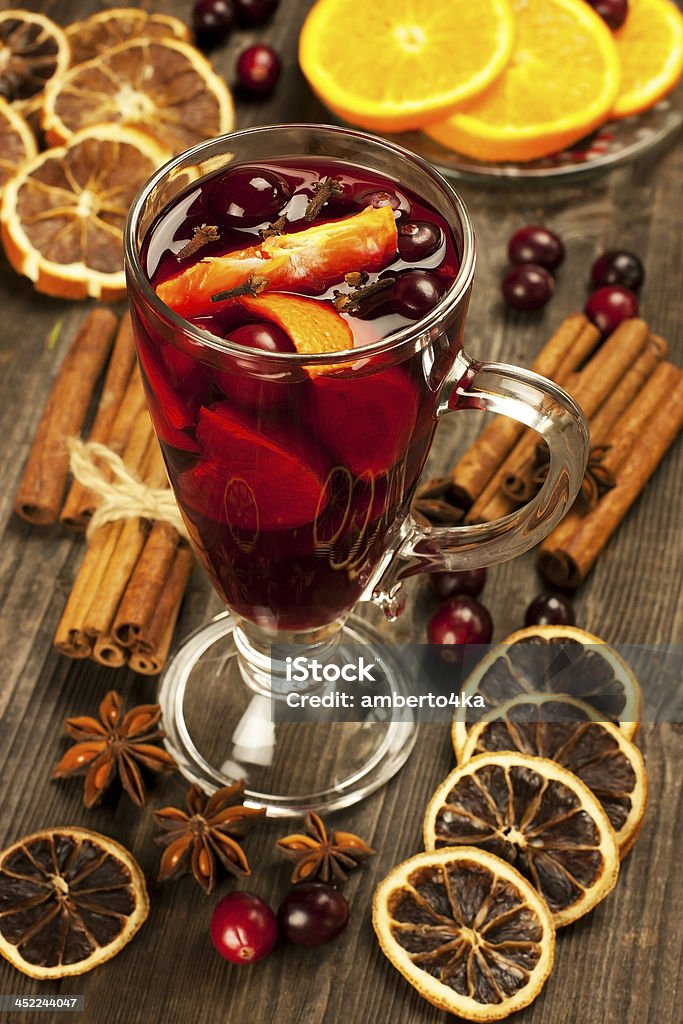 Glass with mulled wine and spices Christmas composition with hot spiced wine Advent Stock Photo