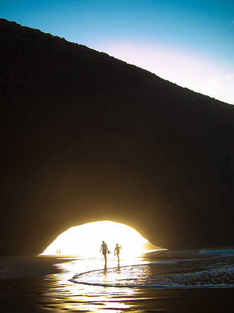 istock Mother and son walk along the beach 452245013