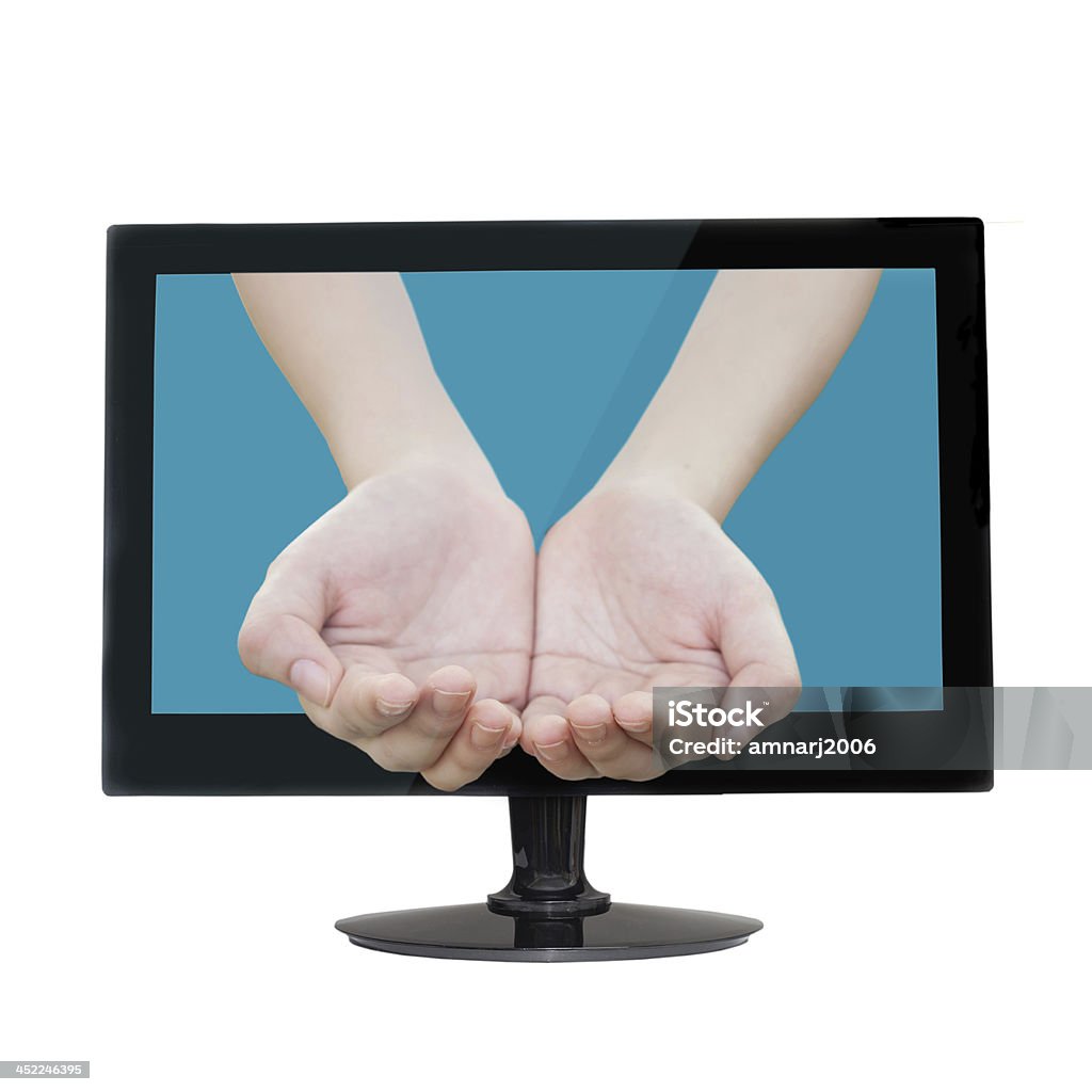 female hands female hands as if holding something come from tv screen. Charity and Relief Work Stock Photo