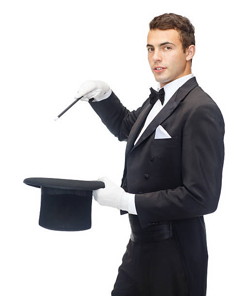 istock magician in top hat with magic wand showing trick 452248375