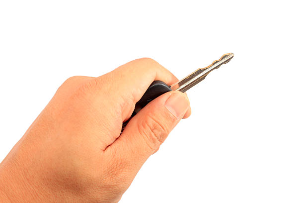 istock Hand holding car keys isolated on white 452251037