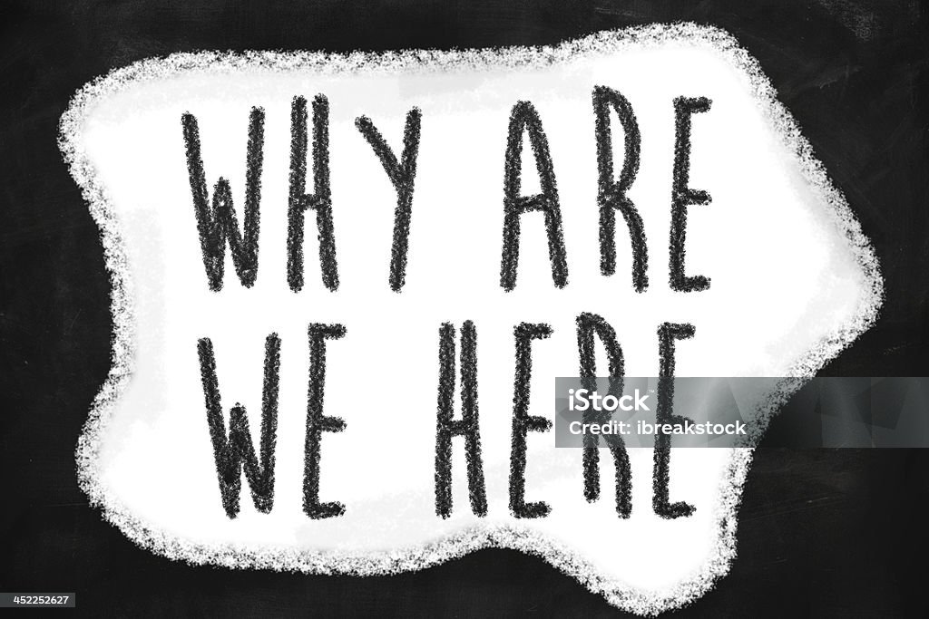 Why are we here Why are we here question written on a blackboard Asking Stock Photo