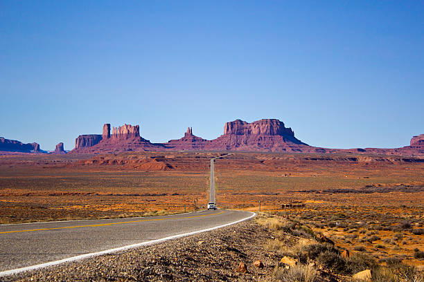 view of the Monument Valley a view of the Monument Valley, coming from Mexican Hat, Utah hystoric stock pictures, royalty-free photos & images