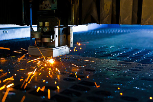 Laser cutting with sparks close up