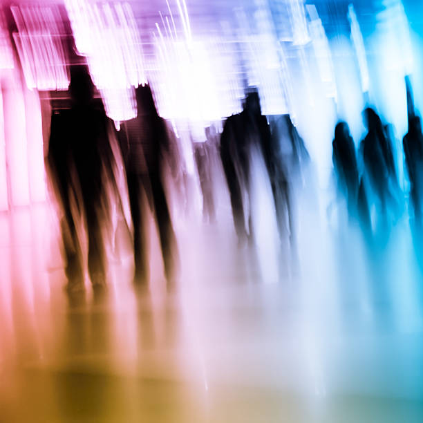 istock Abstract image of businesspeople walking through passageway 452252981