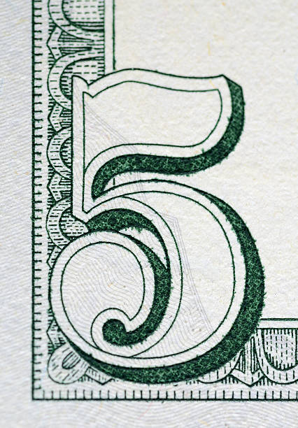 istock Number in the corner of a five dollar bill 452255349