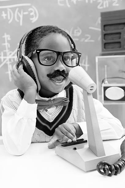 istock Children:  Child plays retro revival radio broadcaster. 452255819
