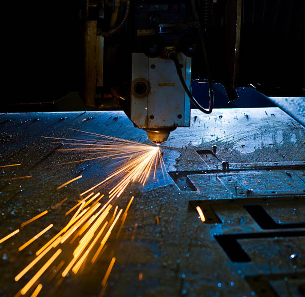 istock Laser cutting metal close up, sparks flying 452257037