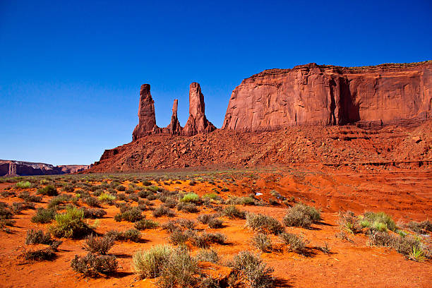 Three Sisters, Monument Valley National Park, Arizona the Three Sisters, a caracteristic rock formation in the Monument Valley National Park hystoric stock pictures, royalty-free photos & images