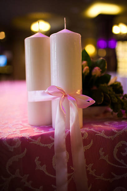 istock candles tied with a pink ribbon 452257473
