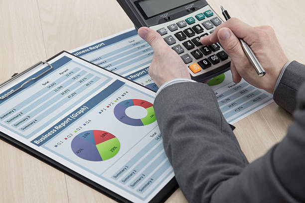 istock man hand with business report 452259315