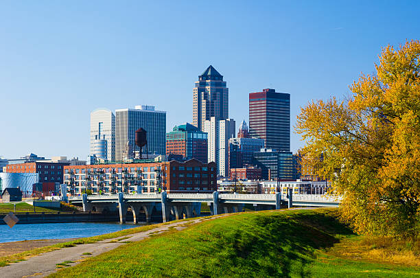 Des Moines Downtown Skyline Des Moines Downtown Skyline, river, grass, and tree during Autumn. iowa stock pictures, royalty-free photos & images
