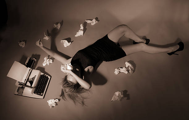 istock Beautiful girl lies at the typewriter. 452266413