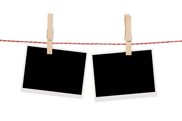 istock Blank photos hanging on clothesline 452268147