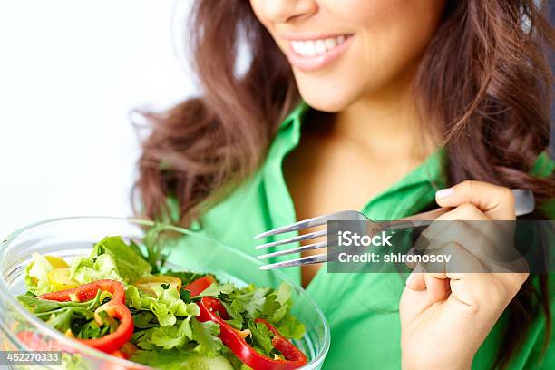 Focus On Clear Bowl Of Salad Held By Smiling Woman On A Diet Stock Photo - Download Image Now