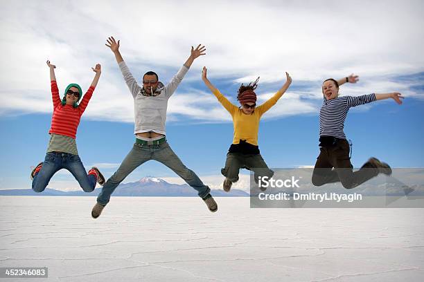 Happy Friends Jumping Outdoor Stock Photo - Download Image Now - People, Jumping, Generic Location