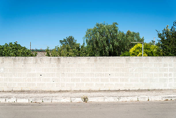 istock Old concrete grunge wall with sidewalk 452346383