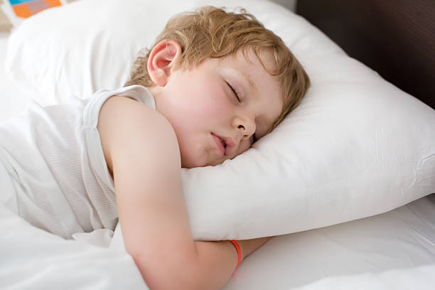 istock Little sweet toddler boy sleeping in his bed 452351867
