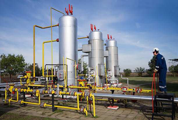 istock A worker examining oil pumps and pipelines 452354041