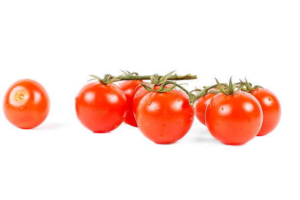 istock Organic vegetables, tomatoes on white background 452354999