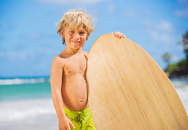istock Happy Young boy having fun at the beach on vacation 452368901