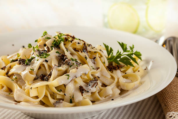 Pasta with Truffle Vegetarian pasta with cream sauce and truffle mushrooms. tartuffo stock pictures, royalty-free photos & images