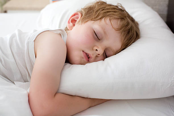 istock Little sweet toddler boy sleeping in his bed 452376501