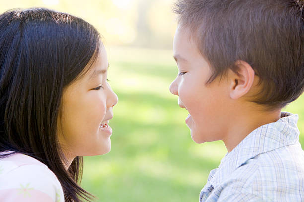 istock Brother and sister outdoors staring at each other 452386823